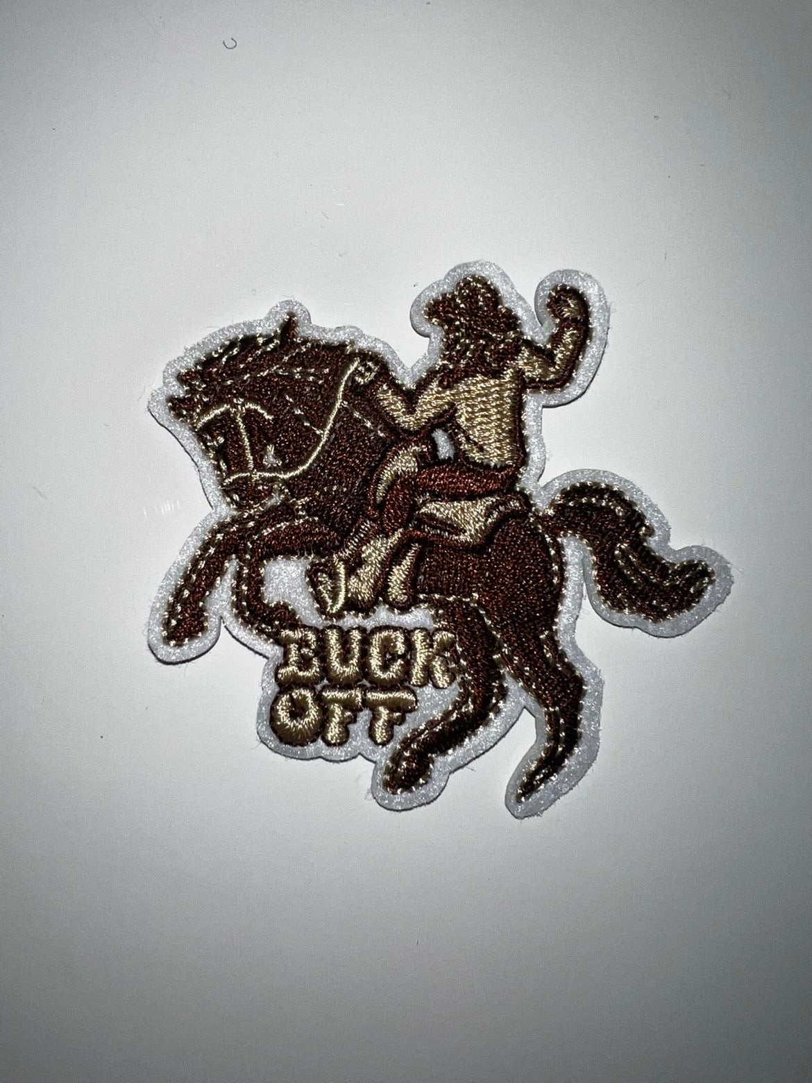 Buck off patch